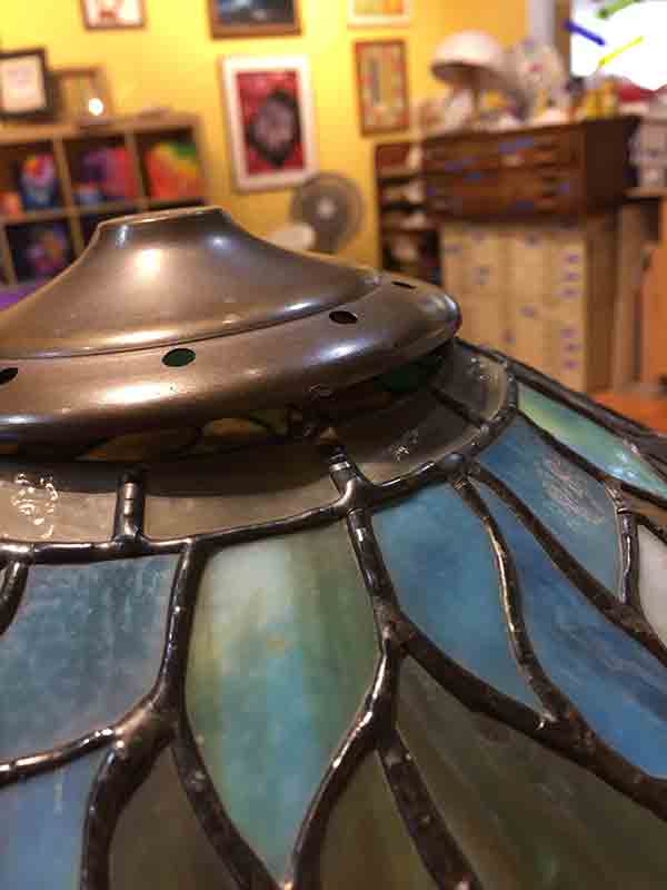 Separation of cap from glass art.